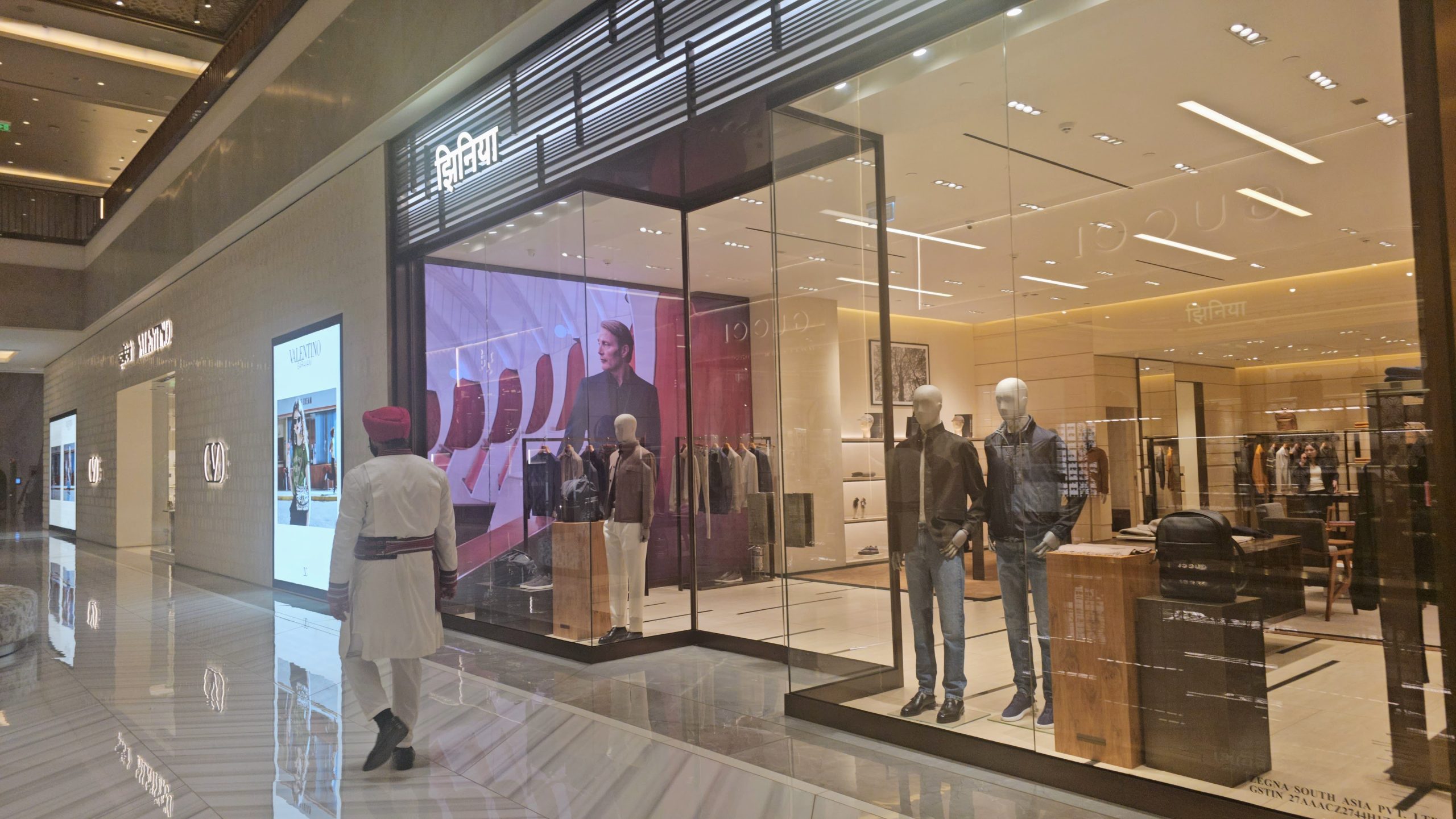 Client entering a store on a rainy day, symbolizing appreciation and human connection in service and leadership